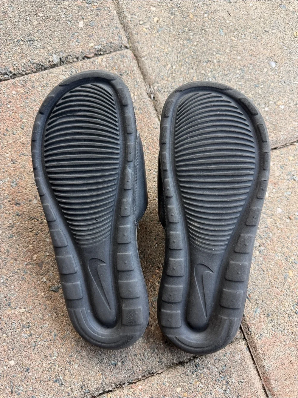 Nike Black Slides with White Swoosh Logo